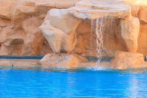 Beautiful small waterfall in the swimming pool