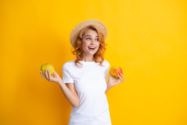 Beautiful smile of young woman holding apple