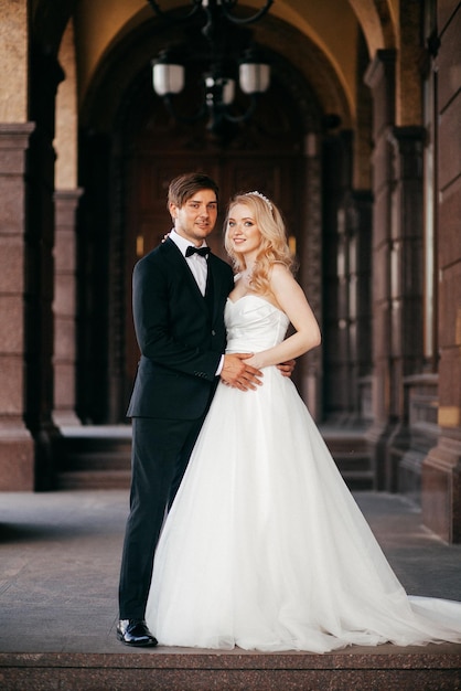 Beautiful and smiling bride and groom