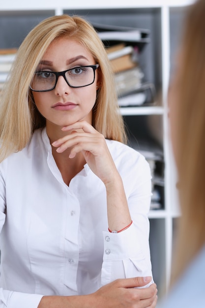 Beautiful smiling businesswoman portrait at workplace