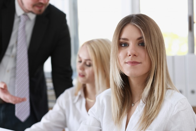 Beautiful smiling businesswoman portrait at workplace