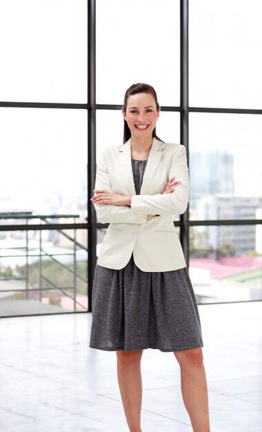 Beautiful smiling businesswoman with folded arms