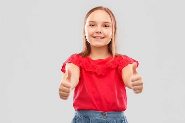 beautiful smiling girl showing thumbs up