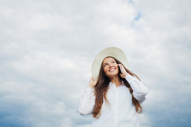 Beautiful smiling girl talking on the phone.