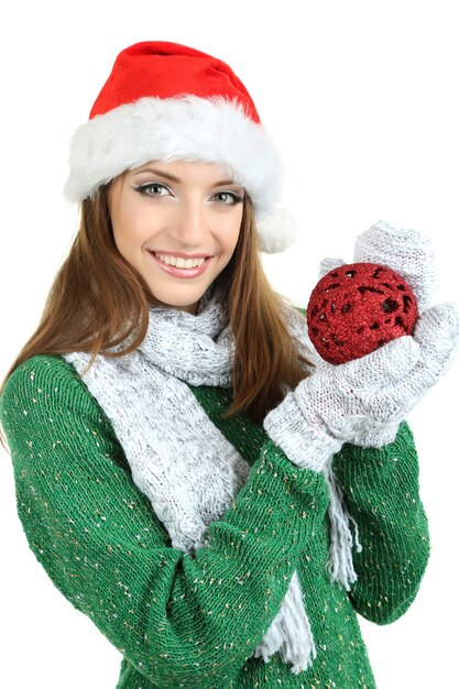 Beautiful smiling girl with Christmas ball isolated on white