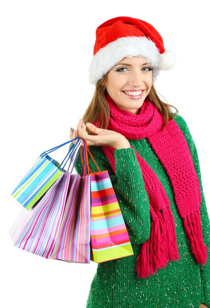 Beautiful smiling girl with gift bags isolated on white