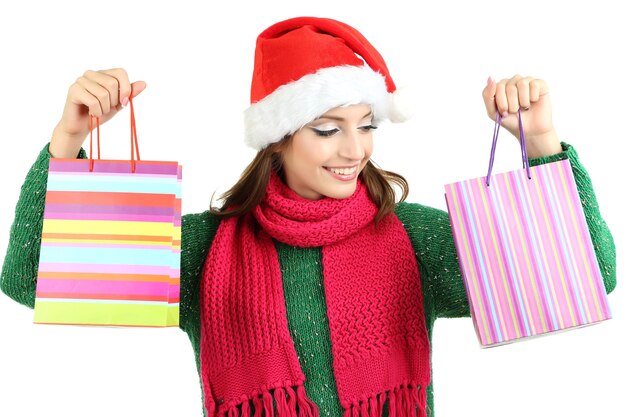 Beautiful smiling girl with gift bags isolated on white