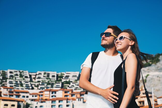 Beautiful smiling happy couple in love walking in portopiccolo sistiana italy europe