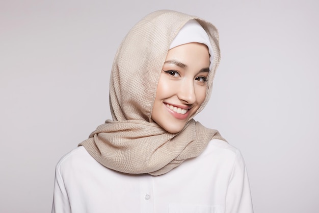 beautiful smiling islamic young woman with Makeup beauty Happy girl in hijab