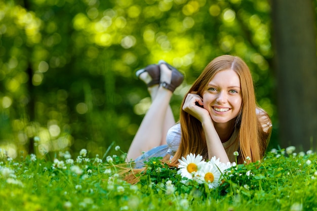 Beautiful smiling red-haired young woman
