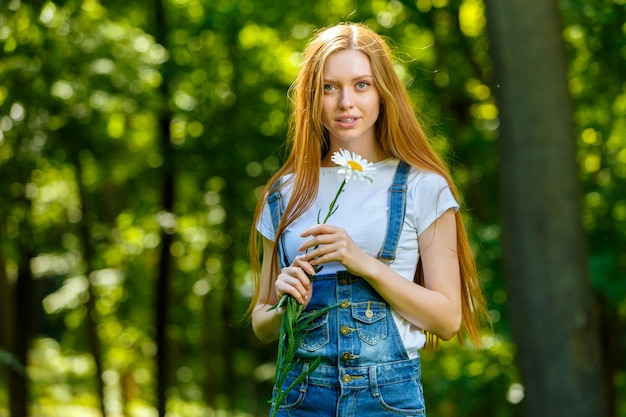 Beautiful smiling red-haired young woman