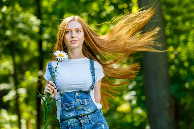 Beautiful smiling red-haired young woman