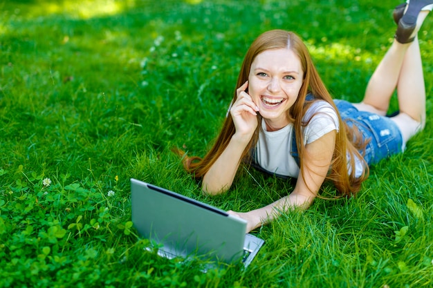 Beautiful smiling red-haired young woman