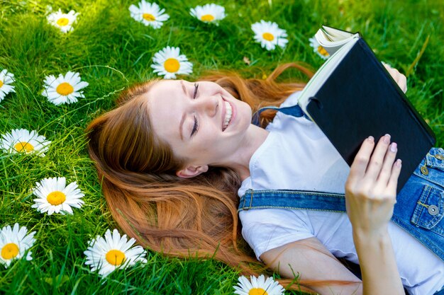 Beautiful smiling red-haired young woman