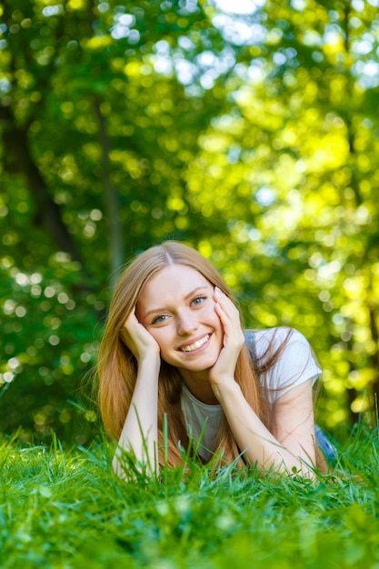 Beautiful smiling red-haired young woman