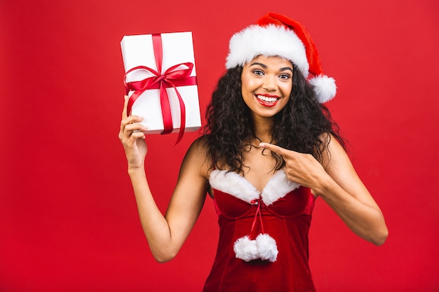 Beautiful smiling woman in Santa Claus clothes