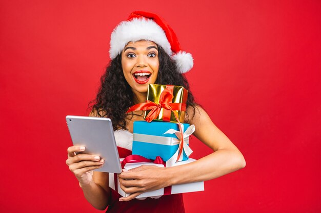 Beautiful smiling woman in Santa Claus clothes