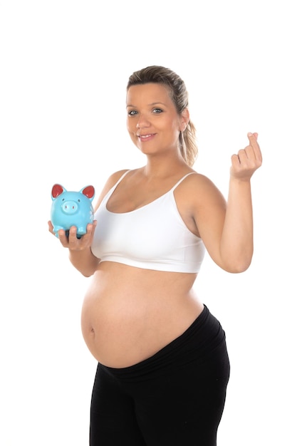 Beautiful smiling woman waiting for baby holding a moneybox