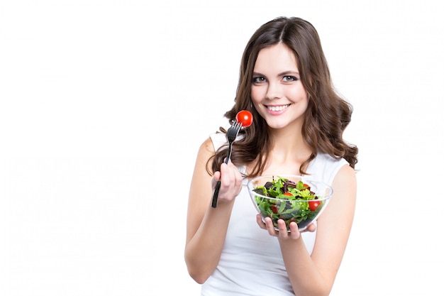 Beautiful smiling woman with salad isolated.