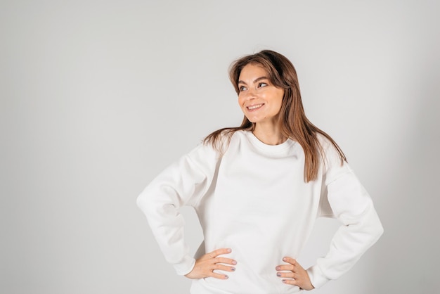 Beautiful smiling young woman Isolated over white background