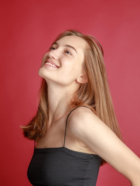 Beautiful smiling young woman with perfect skin face natural beauty concept isolated on studio background