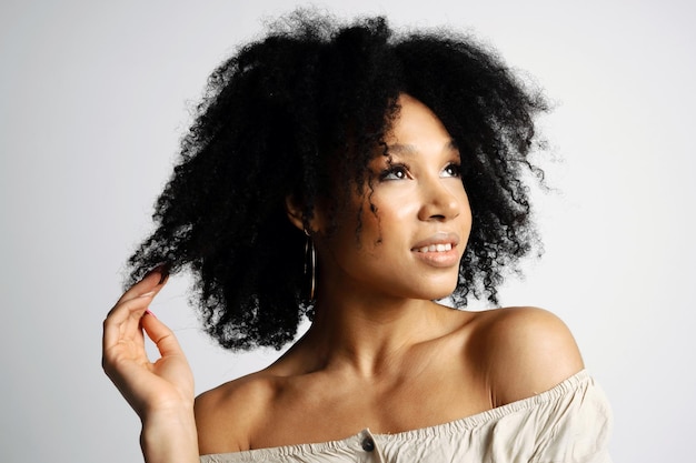 beautiful smooth facial skin portrait of a young female model of brazilian appearance black hair