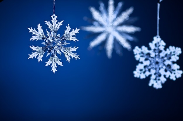 Beautiful snowflakes on blue gradient background. Christmas concept