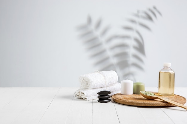 Beautiful spa composition on massage table in wellness center, copyspace