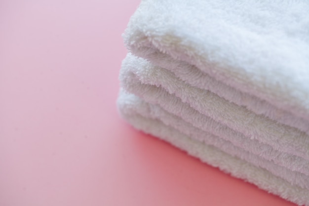 Beautiful Spa Composition White Towels on Pink Table