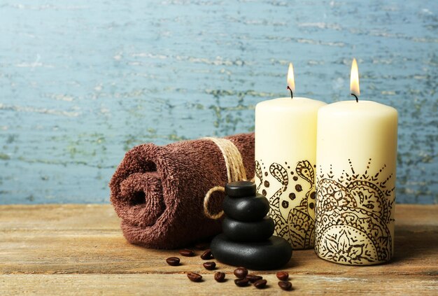 Beautiful spa composition with decorative Indian candles on wooden table