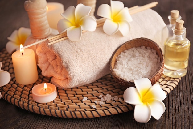 Beautiful spa composition with flowers on wooden background