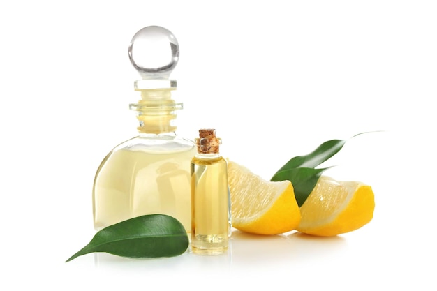 Beautiful spa composition with lemon essential oil on white background closeup