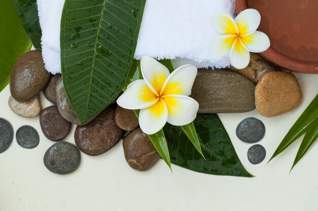 Beautiful spa composition with stones on white background