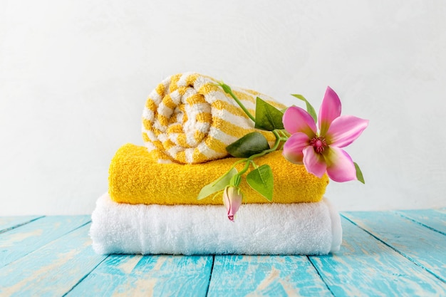 Beautiful spa composition on wooden table with flowers