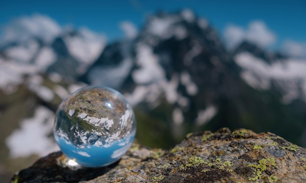 Beautiful spherical glass ball with majestic Caucasian mountains