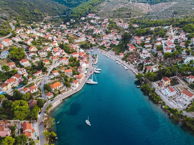 Beautiful Splitska harbour on island Brac Croatia Aerial view Crystal blue waterAdriatic sea