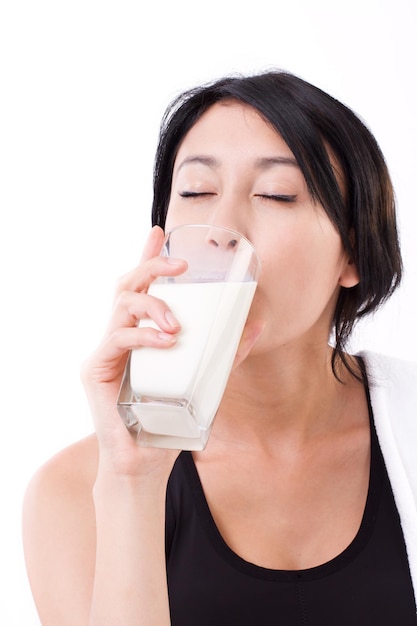 Beautiful sport woman drinking milk