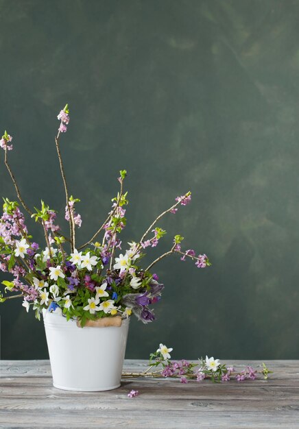 Beautiful spring flowers on background dark wall