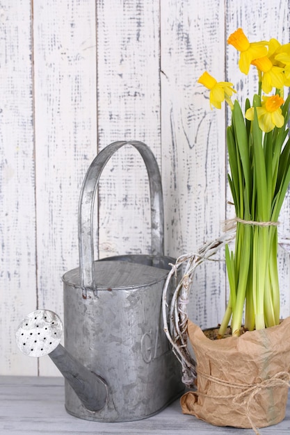 Beautiful spring flowers on old wooden background