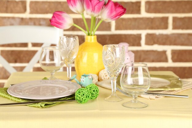 Beautiful spring table setting on bright background