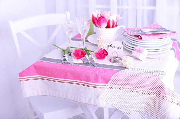 Beautiful spring table setting on light background