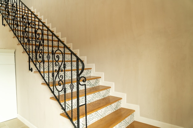 beautiful stair step with black handrail