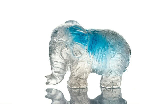 Beautiful statuette elephant from the mineral topaz on a white background
