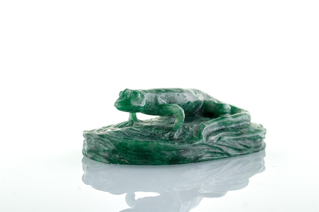 Beautiful statuette of lizard salamander from malachite on a white background