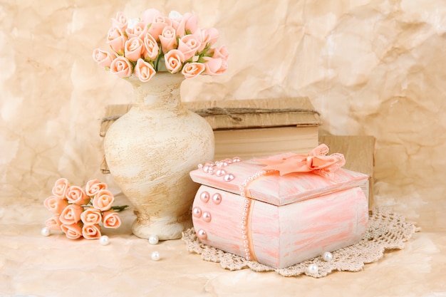 Beautiful still life with vintage casket and flowers