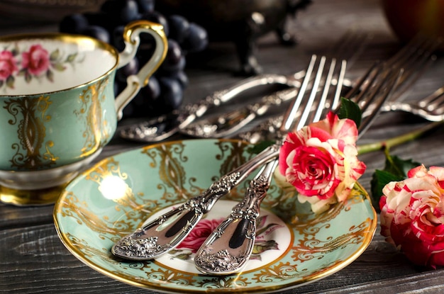 Beautiful still life with vintage Cup Cup and saucer with gilding Vintage style Selective focus