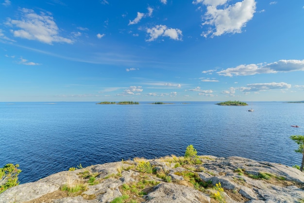 Beautiful stones and pine trees on the lake Landscape of wild nature