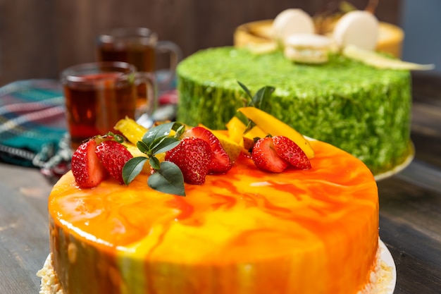 Beautiful strawberry cake on the wooden table