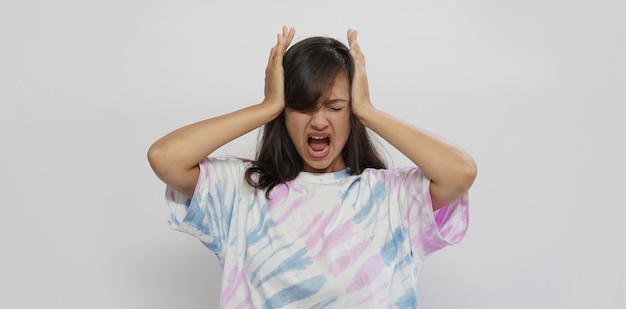 Beautiful stressed woman in grey color background