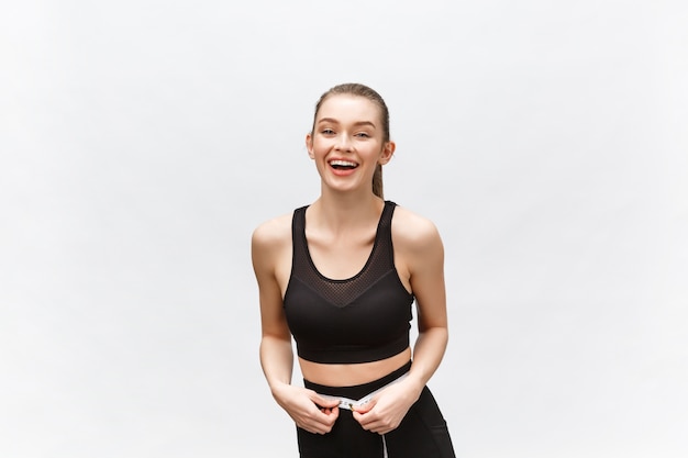 beautiful strong happy cheerful young sports woman posing